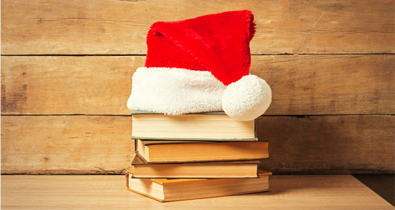 Santa hat on book pile