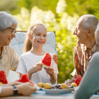 family eating watermelon