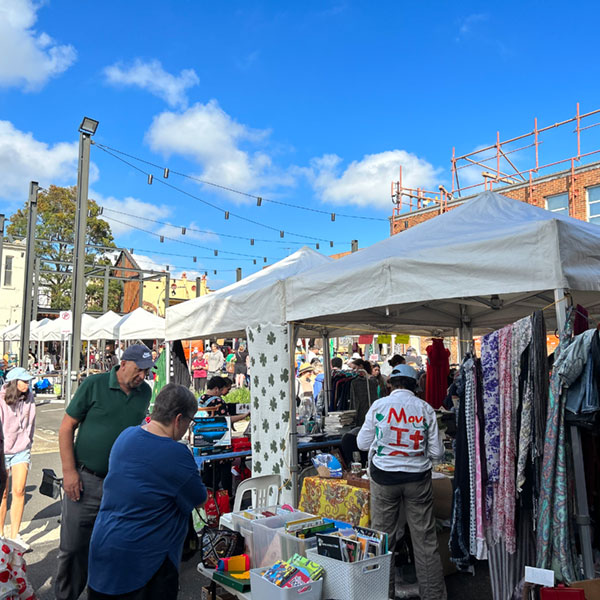 people at market stall