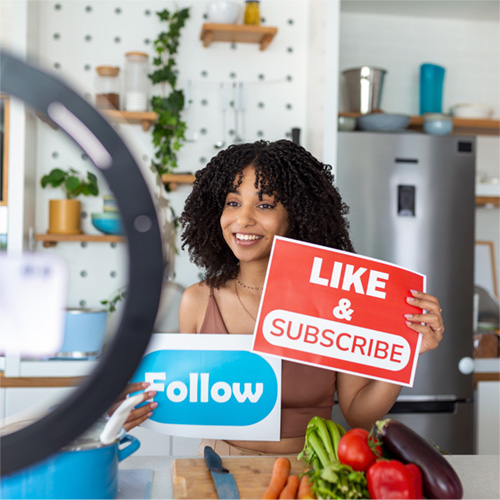 person sitting holding social media signs