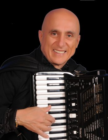 Ross holding accordion